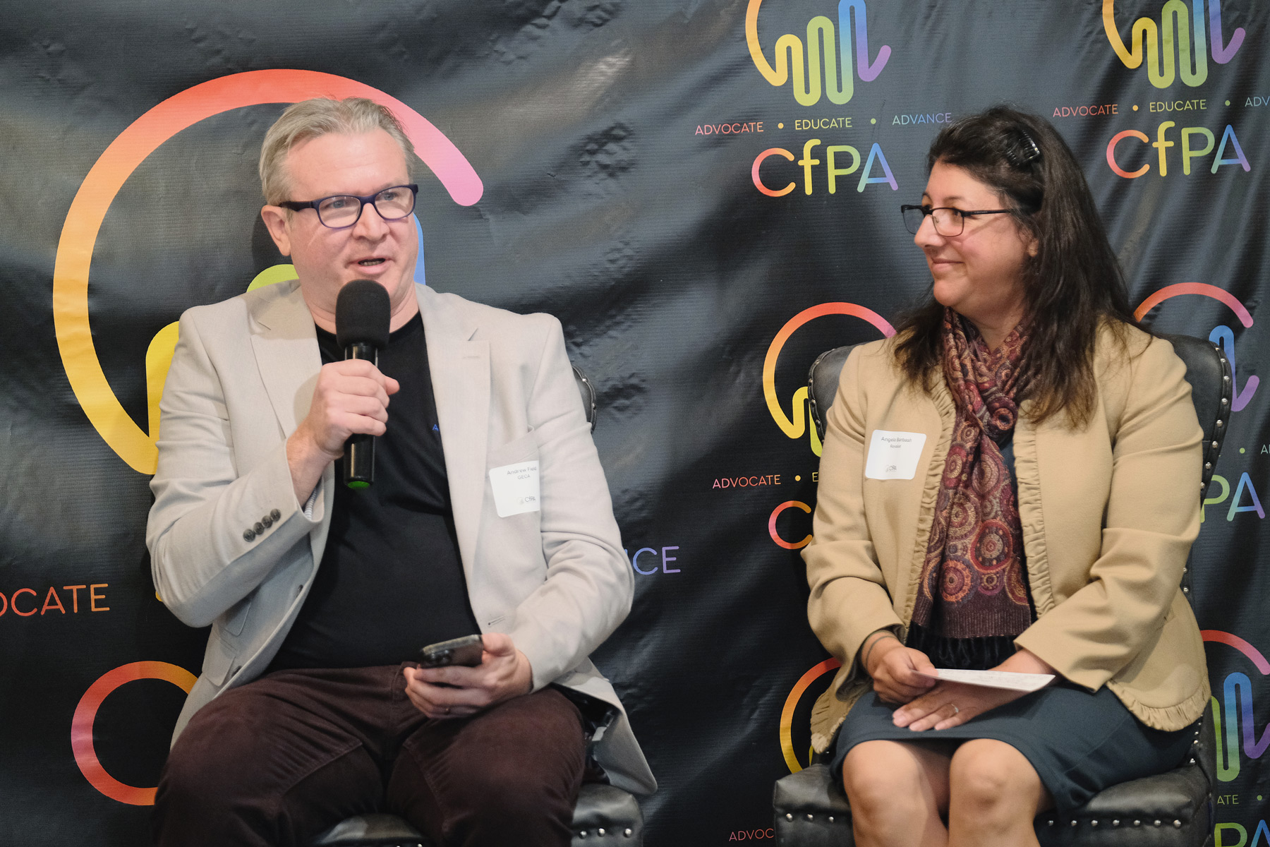 Andrew Field GECA Executive Lead speaking on stage at 2025 Crowdfunding Professional Association Summit about global regulatory harmonization