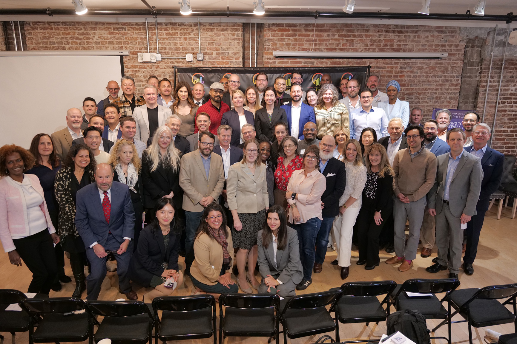 Large group photo of attendees at 2025 CfPA Regulated Investment Crowdfunding Summit Washington DC including regulators platform executives industry leaders