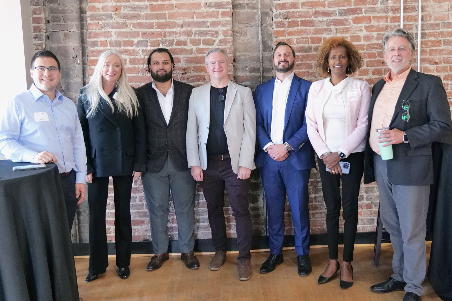 GECA Steering Committee members at 2025 Crowdfunding Professional Association Summit - group photo of seven global crowdfunding leaders including platform executives and CfPA officers